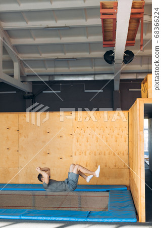 man is falling on the mat after climbing man is falling on the mat after climbing 68366224