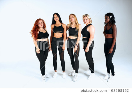 five different nation models posing in white background 68368162