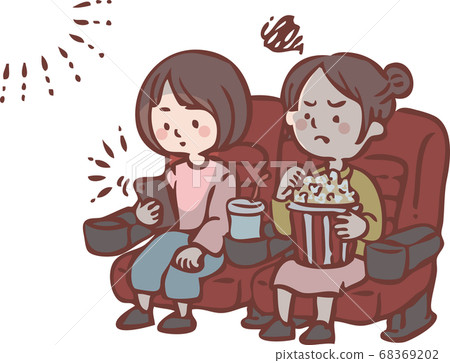 Woman looking at smartphone during movie screening Woman looking at smartphone during movie screening 68369202