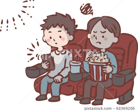 A man watching a smartphone during a movie screening A man watching a smartphone during a movie screening 68369206