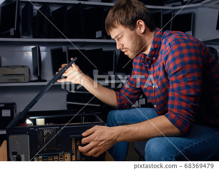 serious man having problems with system unit serious man having problems with system unit 68369479