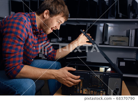 excited emotional man opening the system unit excited emotional man opening the system unit 68370790