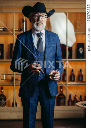 Portrait of man. The man smokes a cigar. Black and white photo Portrait of man. The man smokes a cigar. Black and white photo 68370815