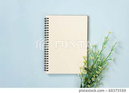 Spiral Notebook or Spring Notebook and Daisy Flowers on Pastel Minimalist Background Spiral Notebook or Spring Notebook and Daisy Flowers on Pastel Minimalist Background 68373589