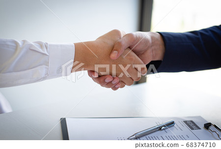 Business people shake hands to congratulate new employees in interviews after meeting in office, job interview Concept. Business people shake hands to congratulate new employees in interviews after meeting in office, job interview Concept. 68374710