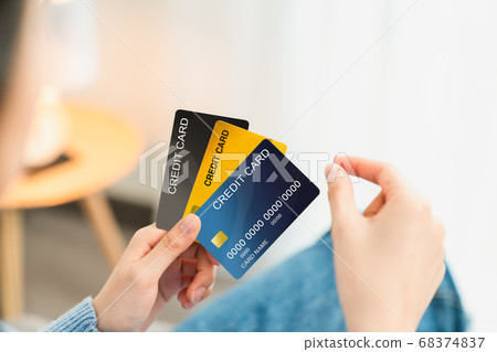 Hand holding credit card and pick take to shopping. 68374837