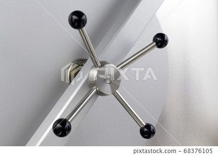 The closed solid bank vault iron door 68376105