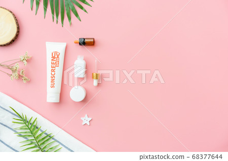 Sunscreen bottle cream, mockup of beauty product brand. Top view on the pink background. Sunscreen bottle cream, mockup of beauty product brand. Top view on the pink background. 68377644
