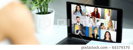 Woman talking with international colleagues using online video chat service Woman talking with international colleagues using online video chat service 68379370