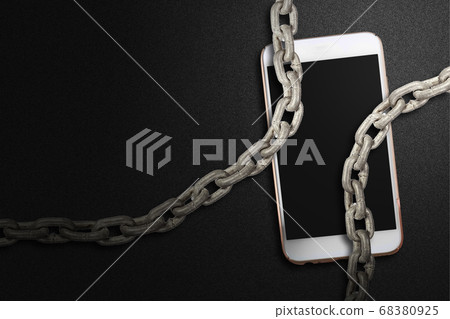 Chain fence locking smartphone on black background Chain fence locking smartphone on black background 68380925