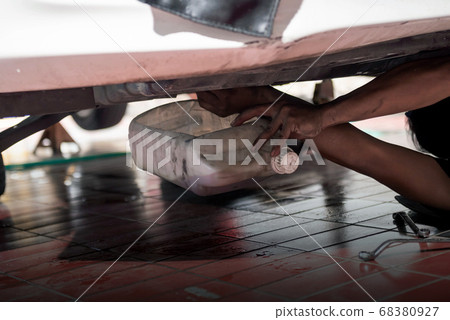 Car mechanic change the car engine oil Car mechanic change the car engine oil 68380927