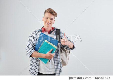 School student showing thumbs-up 68381873