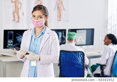 Doctor in rubber gloves and medical mask Doctor in rubber gloves and medical mask 68381952