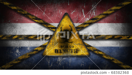 Coronavirus COVID-19 outbreak. Worn Yellow Biohazard, danger, warning sign over flag of Netherlands 68382368