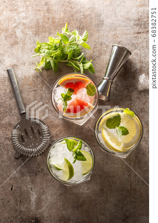 Three colorful gin tonic cocktails in whiskey 68382751