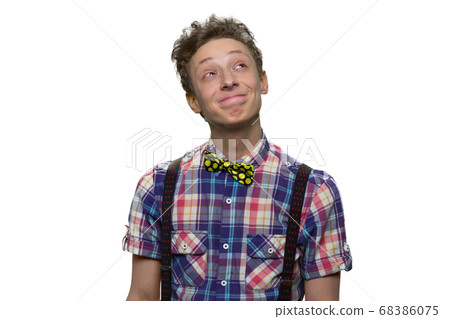 Teenage boy is looking up and thinking. 68386075