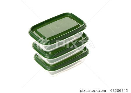 Three clear plastic food containers with green lids. Three clear plastic food containers with green lids. 68386845