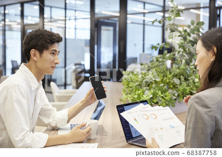 Man having a meeting in a casual office Man having a meeting in a casual office 68387758
