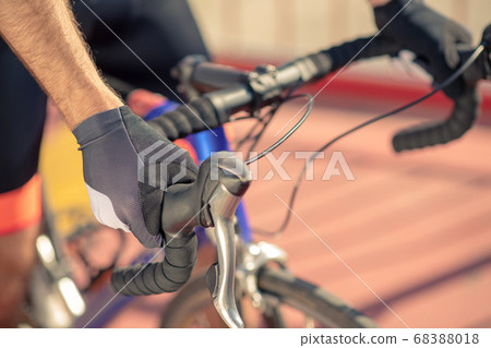 Close-up shot of bicycle handlebar and male hands 68388018