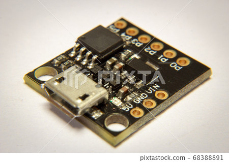 Close up on a ATTiny 32, an arduino-like micro controller Close up on a ATTiny 32, an arduino-like micro controller 68388891
