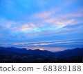 Sunrise clouds over mountain peak 68389188