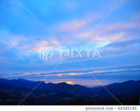 Sunrise clouds over mountain peak 68389188