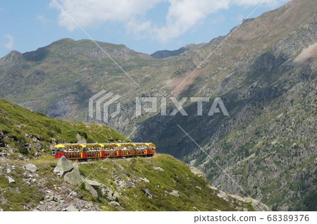 Petit Tran of Altost running on the mountain surface Petit Tran of Altost running on the mountain surface 68389376