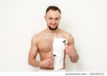 Young man shaving his chest 68389552