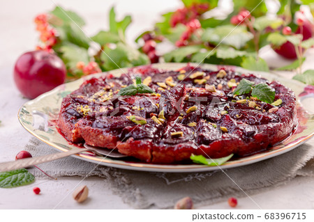 Traditional upside-down pie with plums. 68396715