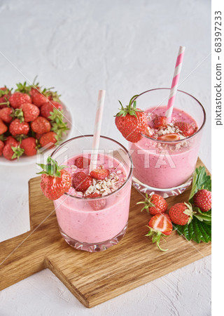 Strawberry milk shake in glass with straw and Strawberry milk shake in glass with straw and 68397233