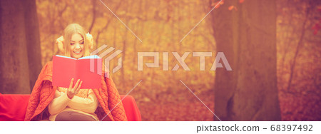 Blonde girl with red book. Blonde girl with red book. 68397492