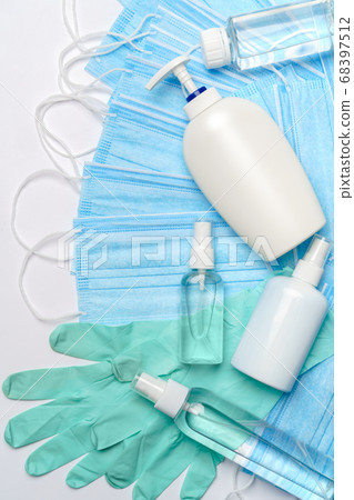 flat layout of hygiene items - latex gloves, mask and hand sanitizer or liquid soap isolated on white background with clipping parh flat layout of hygiene items - latex gloves, mask and hand sanitizer or liquid soap isolated on white background with clipping parh 68397512