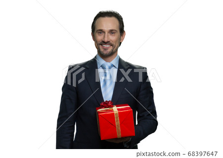 Mature male in suit with a gift. Mature male in suit with a gift. 68397647