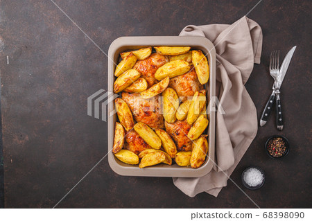 Grilled chicken thighs with spices on table Grilled chicken thighs with spices on table 68398090