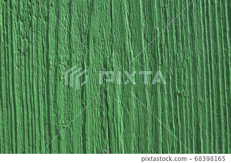 Green paint on an old vertical wooden board. Close-up. the background. copy spase Green paint on an old vertical wooden board. Close-up. the background. copy spase 68398165
