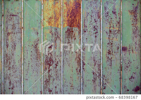 Old rusty metal fence. Green paint will peel off the fence. Close-up. background. copy space Old rusty metal fence. Green paint will peel off the fence. Close-up. background. copy space 68398167