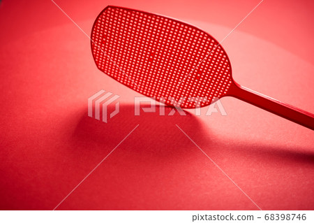 red isolated plastic fly trap on intense colored background 68398746