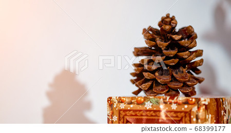 closeup big cone on holiday Christmas box table 68399177