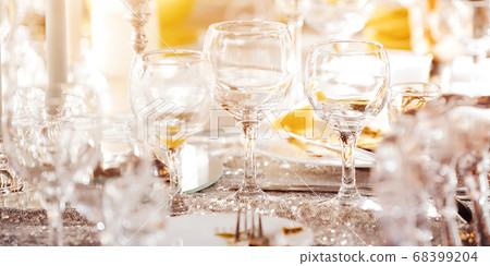 Beautiful festive table of luxury plates, glasses and cutlery served for wine tasting. Close up, blur background. Beautiful festive table of luxury plates, glasses and cutlery served for wine tasting. Close up, blur background. 68399204