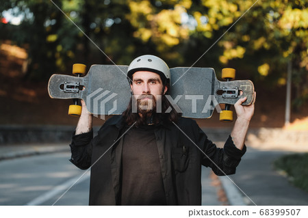 Lifestyle style of sketching, longboard. Portrait of a bearded guy with a board. Lifestyle style of sketching, longboard. Portrait of a bearded guy with a board. 68399507