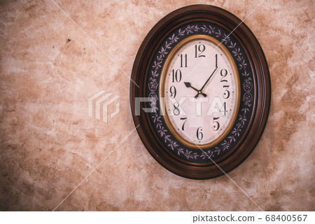 Classic Antique Clock Hanging on Isolated Retro Wall Background, Vintage Ellipse Timer Clock. 68400567