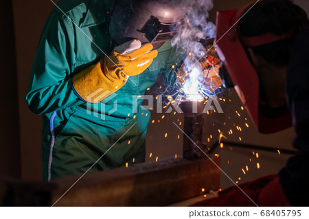 Metal welding steel works using electric arc welding machine Metal welding steel works using electric arc welding machine 68405795
