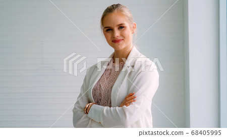 Attractive young woman profile portrait in office Attractive young woman profile portrait in office 68405995