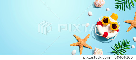 Sunblock bottle wearing sunglasses with starfish and seashells Sunblock bottle wearing sunglasses with starfish and seashells 68406169
