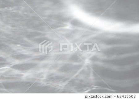 shadow and light caustic effect on a white wall 68413508