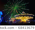 Illuminated night amusement park 68413679