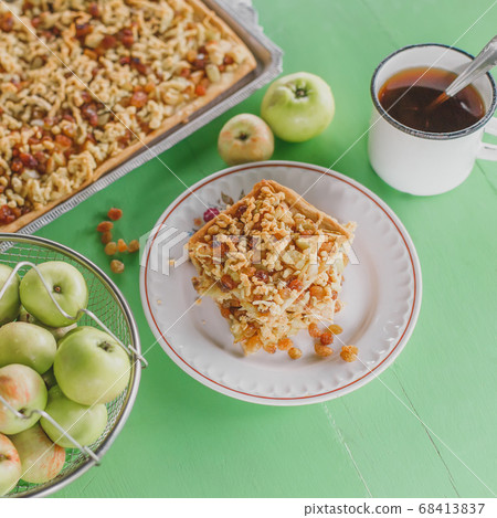 Slim apple pie tart with raisins 68413837