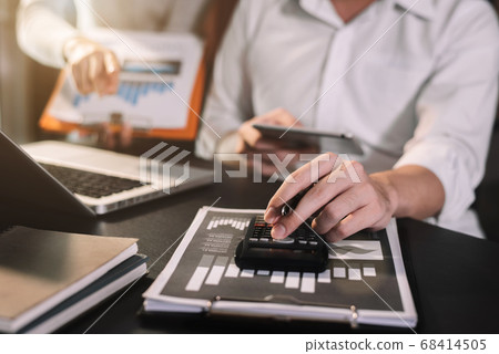 Business team meeting present.professional investor working with new startup project. Finance managers task.Digital tablet laptop computer design smart phone in morning light. Business team meeting present.professional investor working with new startup project. Finance managers task.Digital tablet laptop computer design smart phone in morning light. 68414505