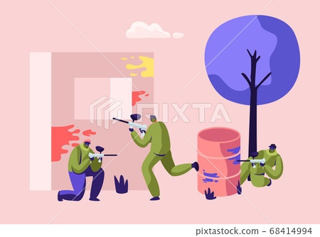 Extreme Paintball Battle. Players in Protective Uniform and Mask Aiming and Shooting with Gun from Embrasure, and Metal Barrel Extreme Paintball Battle. Players in Protective Uniform and Mask Aiming and Shooting with Gun from Embrasure, and Metal Barrel 68414994