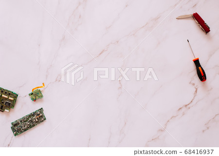 Flat lay of some motherboards against a marble 68416937